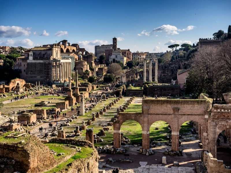 Tourists visit Roman Forum Rome Italy